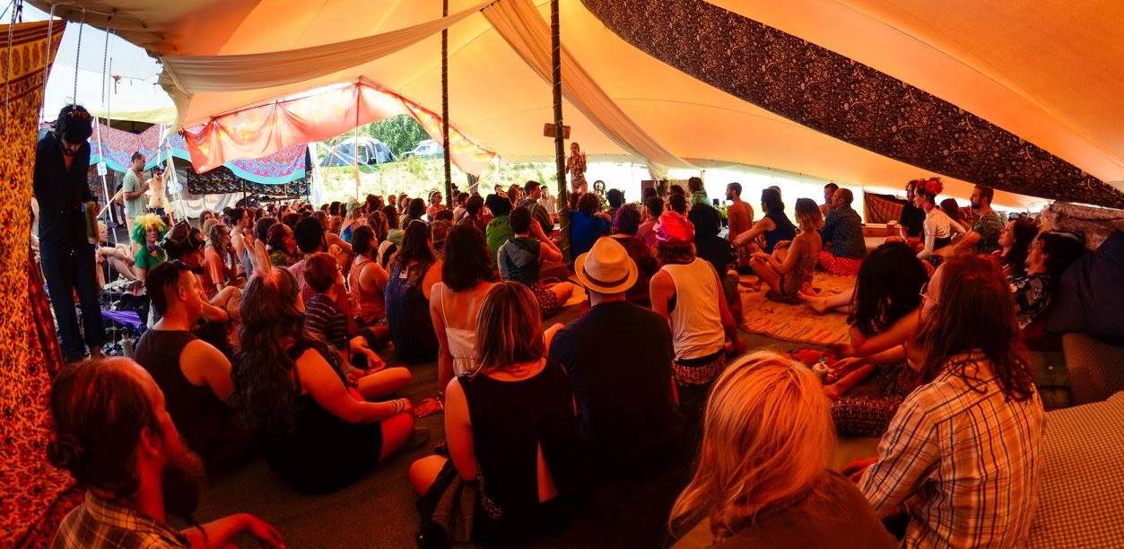 Humans seated under stretch tent, Kiwiburn 2017