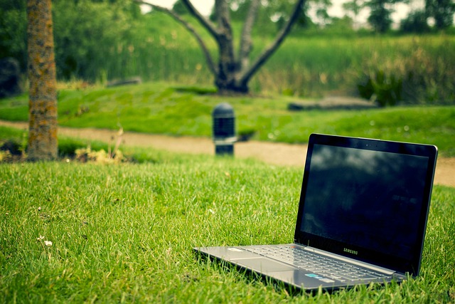 A laptop in a field.