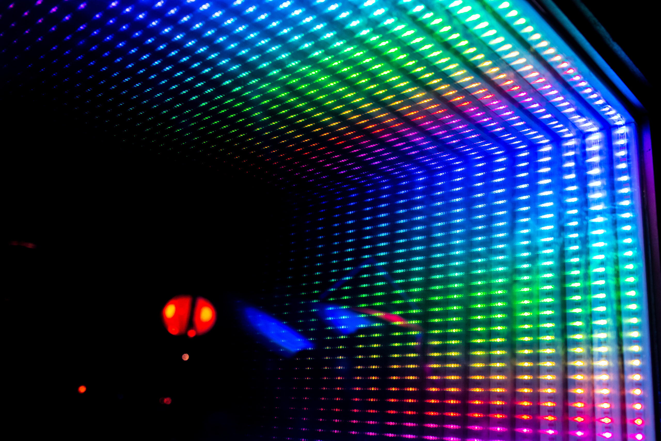 a close up of hundreds of rainbow led lights
