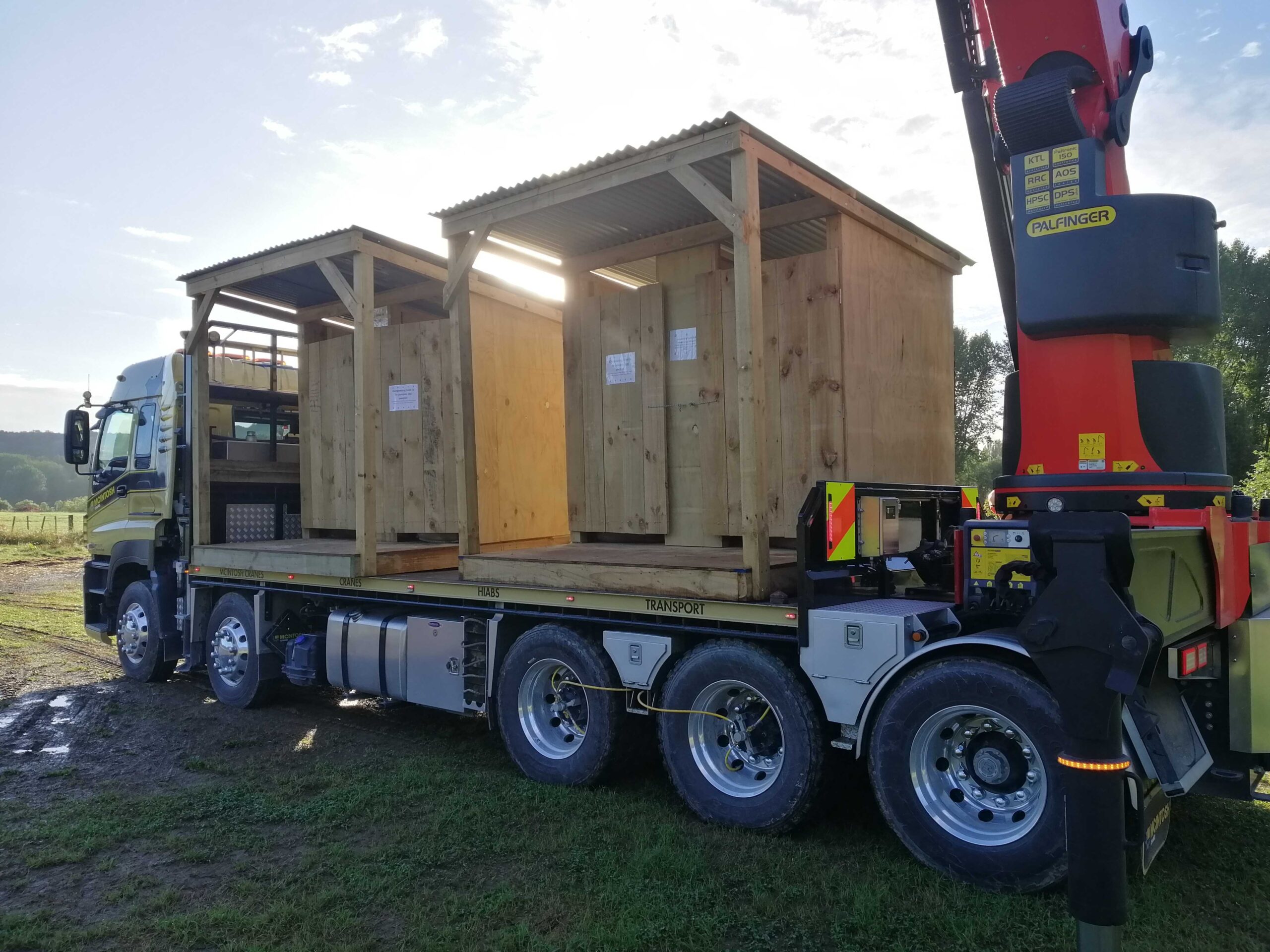 An image of a truck carrying two composting toilets.