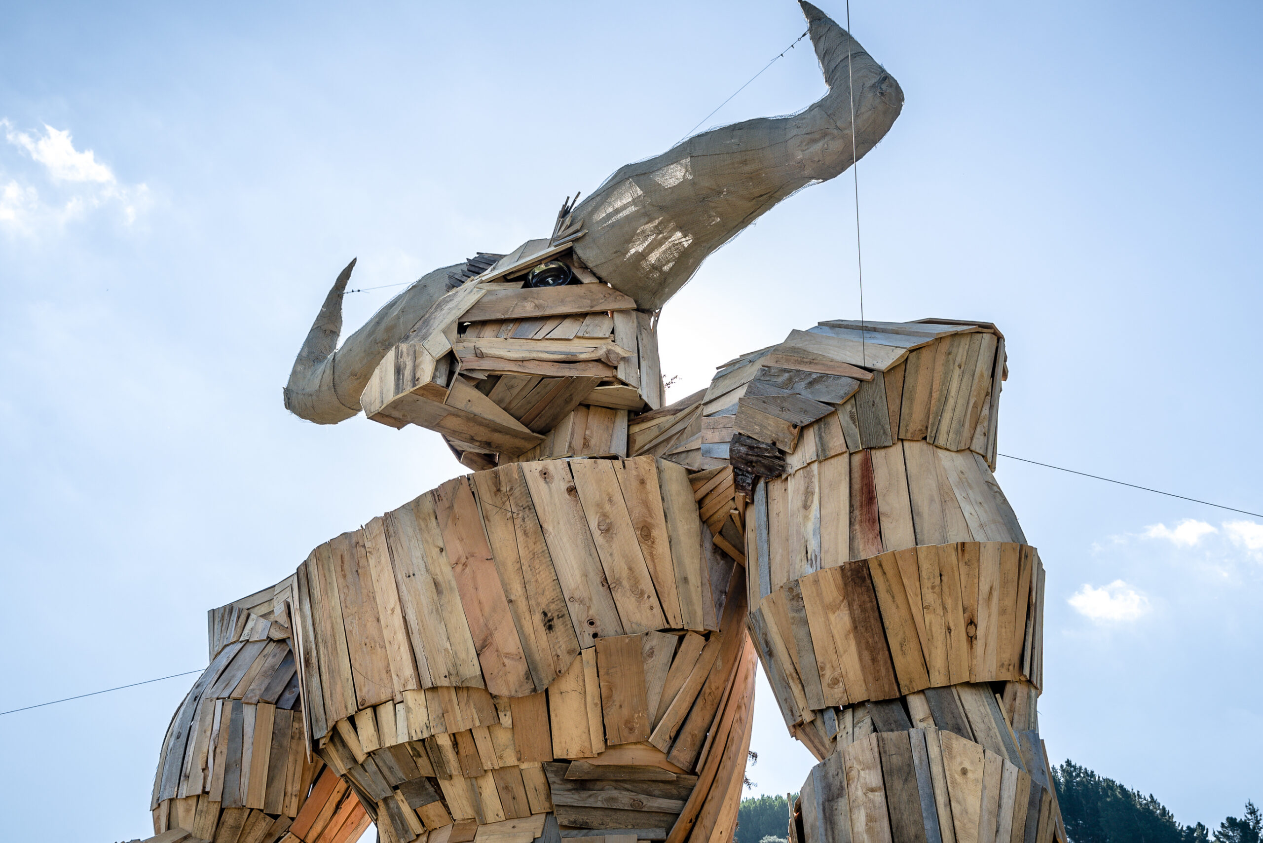 Copy of AndyFlint_2018_8413 a giant wooden minotaur stands proud on a paddock with a blue sky background
