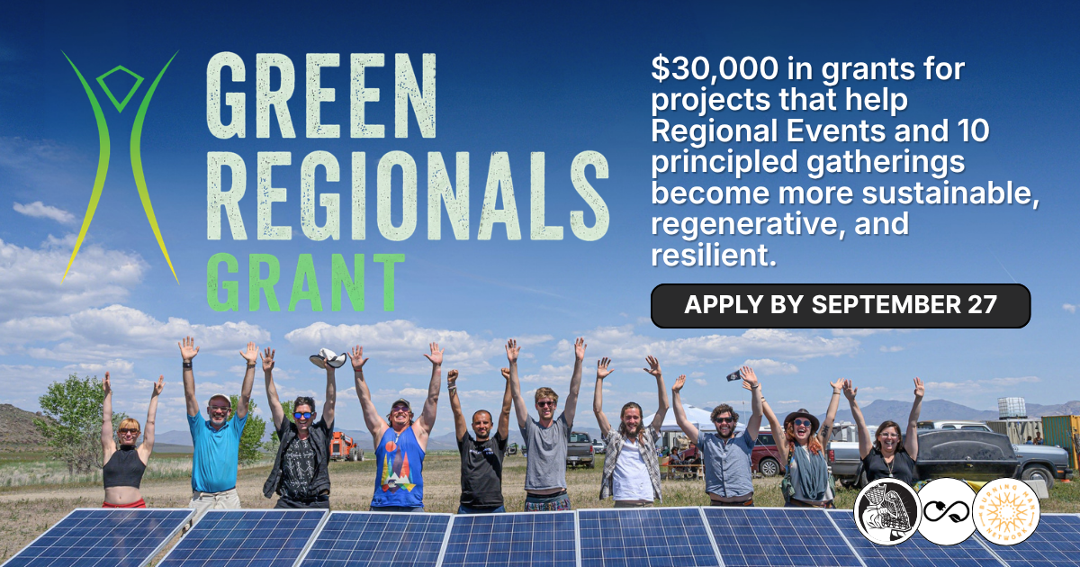 A group of people with their hands up in front of solar panels