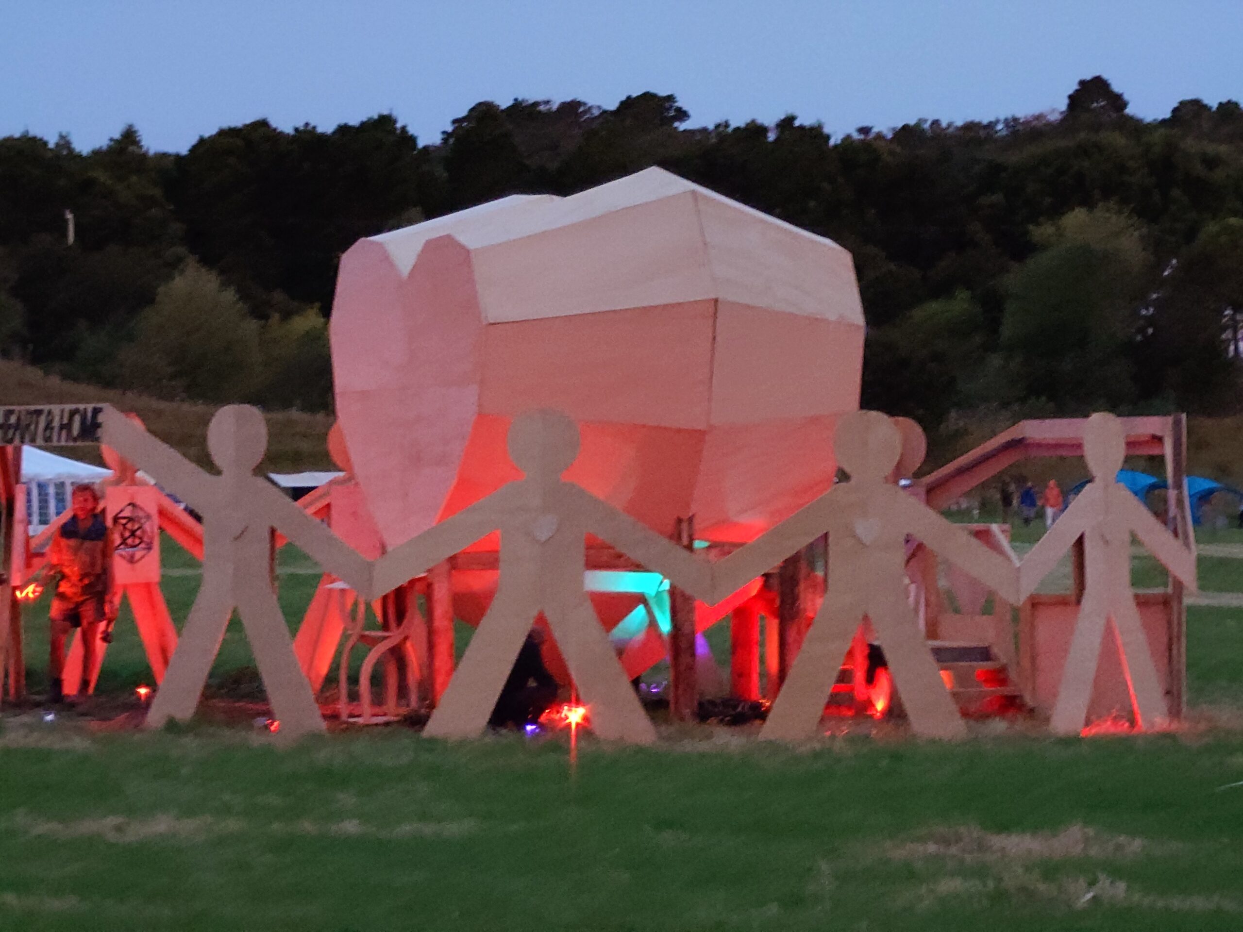 Jane Davies Kiwiburn 2026 temple A close up photo of the Temple from 2026, lit with a pink light